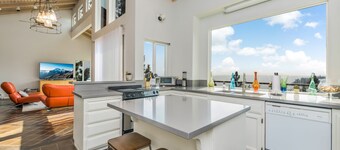 Just above the waters of Meeks Bay, this remarkable home offers unobstructed 180-degree lake views.