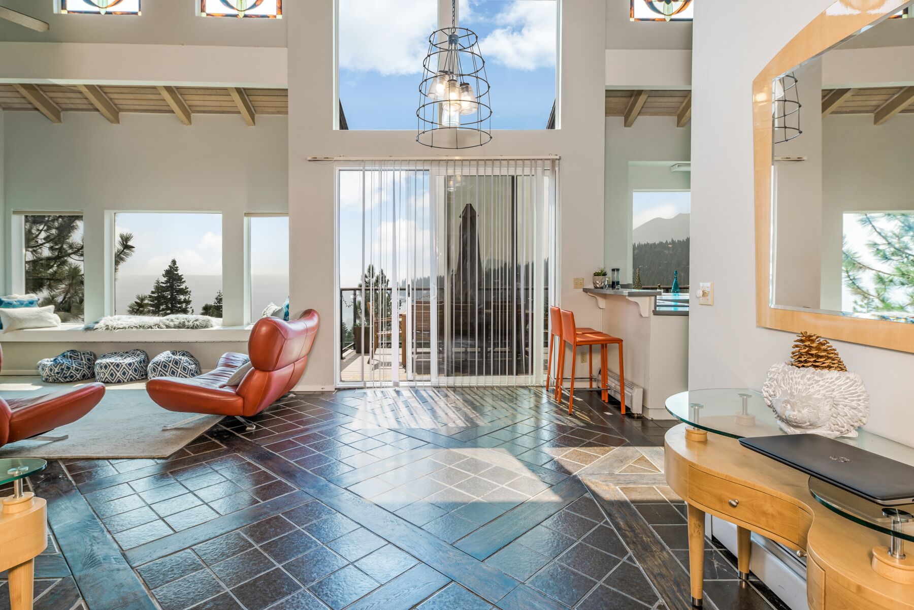 Just above the waters of Meeks Bay, this remarkable home offers unobstructed 180-degree lake views.