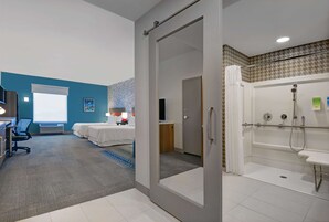 Premium bedding, desk, laptop workspace, blackout drapes