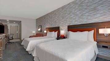 Premium bedding, desk, laptop workspace, blackout curtains