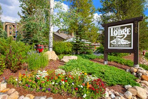 Welcome to The Lodge at Steamboat, surrounded by a beautifully maintained garden.
