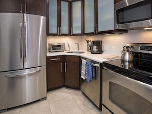 Condo, 2 Bedrooms | Private kitchen | Fridge, oven, coffee/tea maker, toaster