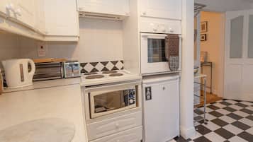 Microwave, oven, high chair, dining tables