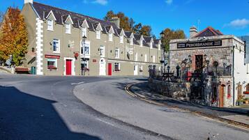 A street view with a traditional building labeled "The Meath Arms" and a sign for "Pescogrande Take Away."