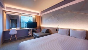 A modern hotel room with a large bed, a television, a desk with a computer, and a window with a city view. - EN HOTEL Hiroshima (Hiroshima)