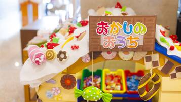 A colorful display of sweets and treats, including a sign with Japanese characters.