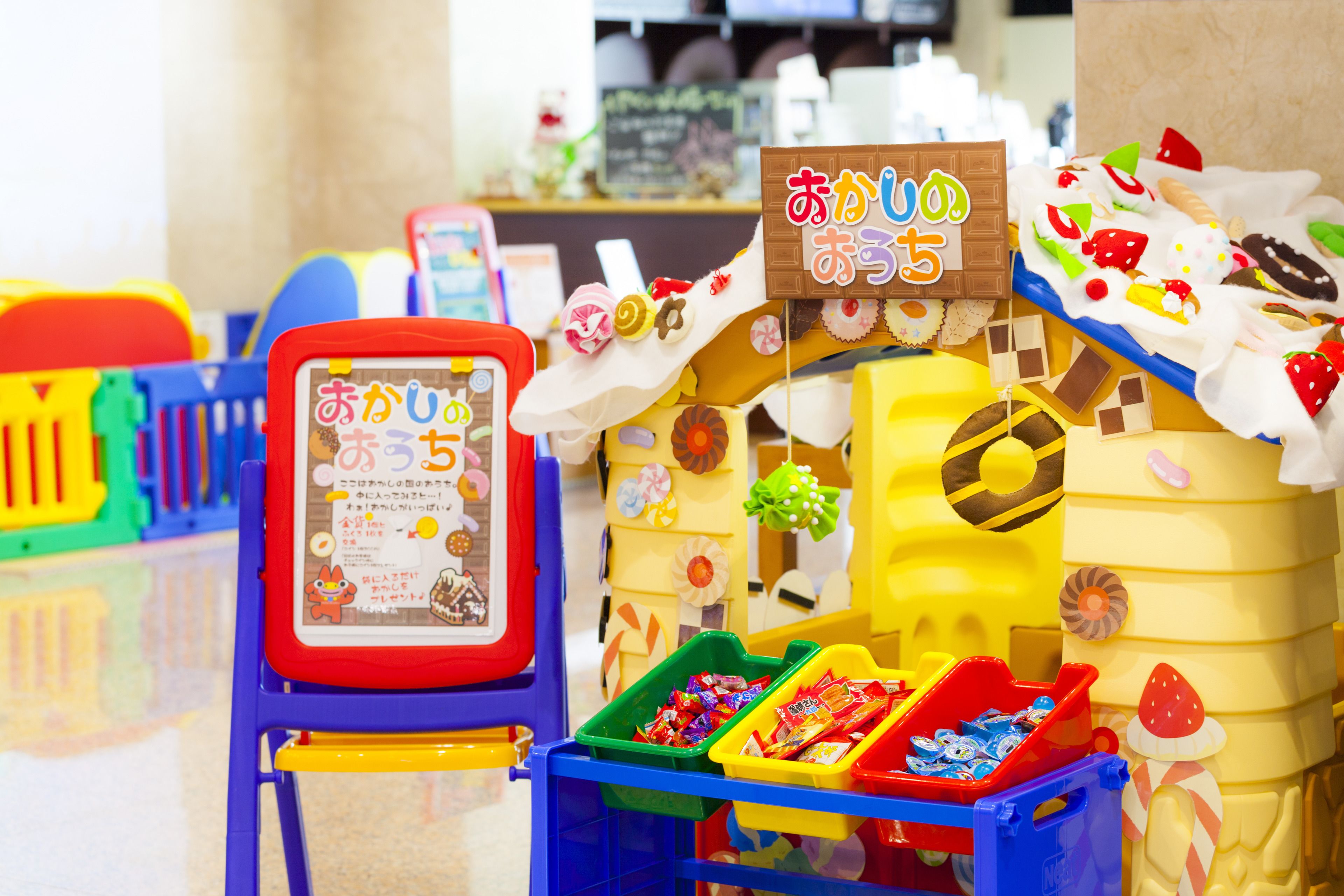 A colorful display with various food items and a signboard.