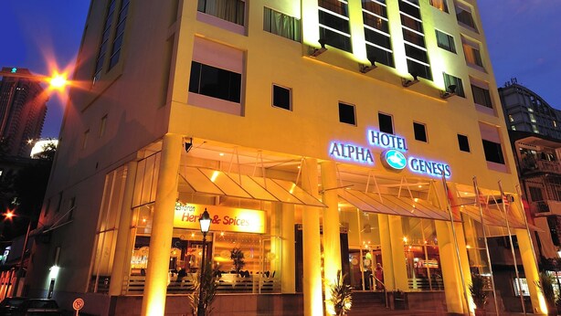 A multi-story hotel with a prominent sign for "Hotel Alpha Genesis." - Alpha Genesis Hotel Kuala Lumpur (Kuala Lumpur)