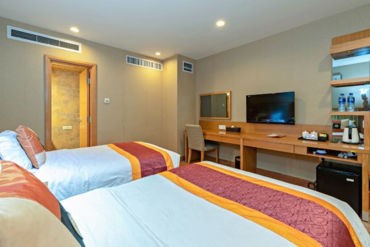 1 habitación, ropa de cama de alta calidad, cubrecamas y minibar 