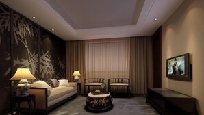 A hotel room with a bed, two chairs, a small table, a round coffee table, a TV, and a large window with curtains. - Veegle Hotel Hangzhou (Hangzhou)