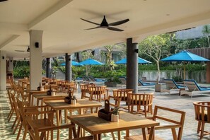 Breakfast, lunch, dinner served; Indonesian cuisine, pool views 