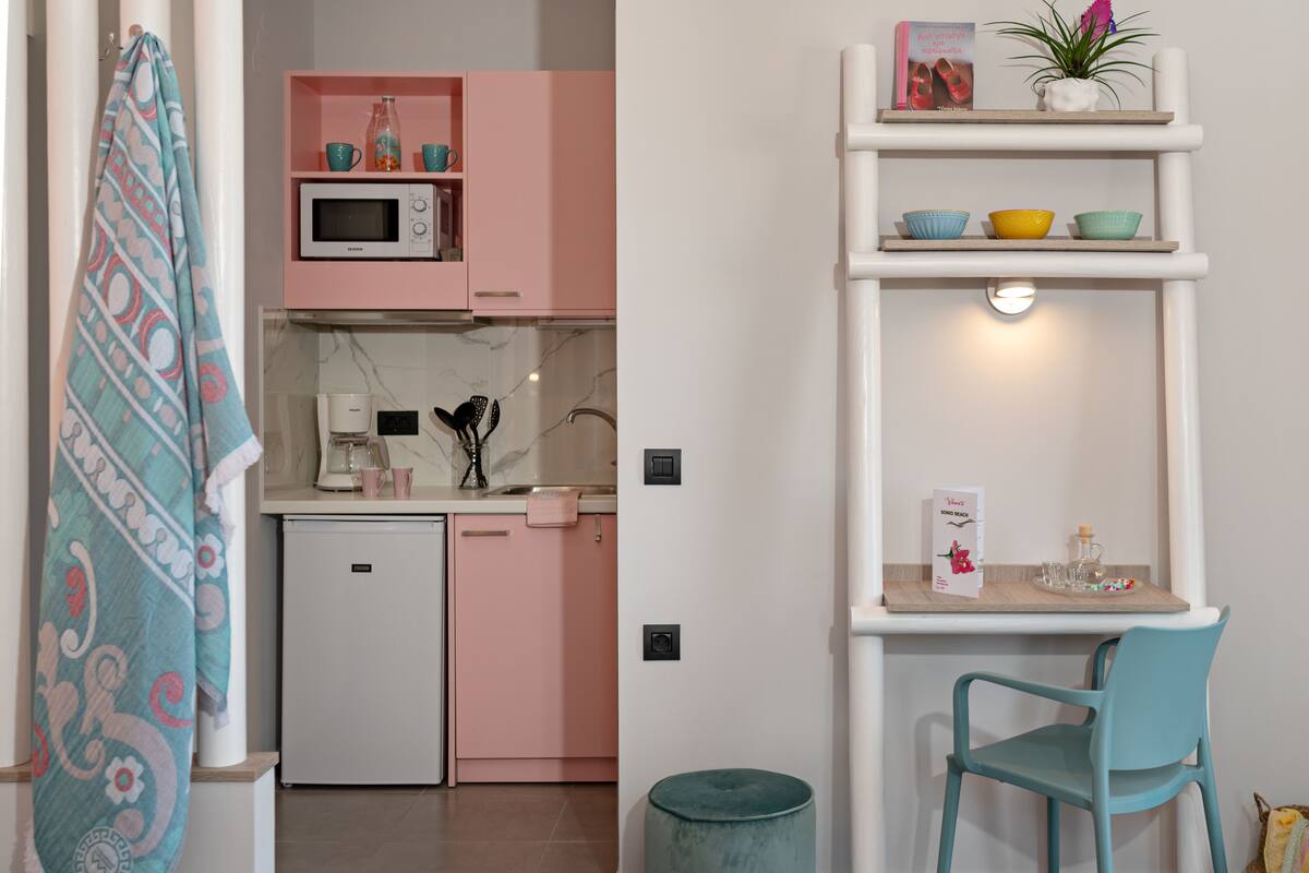 deluxe studio, sea view | in-room safe, desk, blackout curtains, iron/ironing board