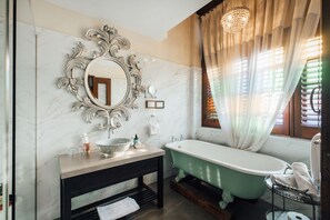 Deluxe Superior | Bathroom | Shower, rainfall showerhead, designer toiletries, hair dryer - Campbell House (George Town)