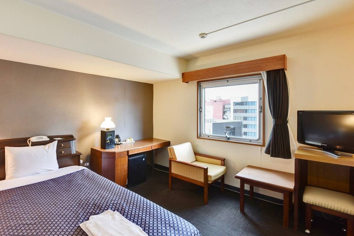 Desk, blackout curtains, iron/ironing board (on request), free WiFi