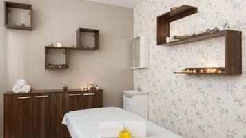 Relax in a clean and modern space with a comfortable bed, dresser, and amenities at your fingertips.