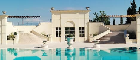 Seasonal outdoor pool, open 10:00 AM to 7:00 PM, free cabanas
