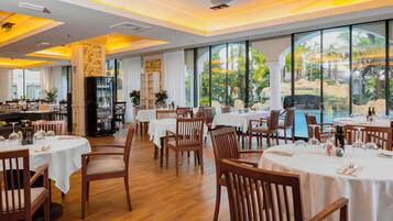 Breakfast, lunch, dinner served; Fusion cuisine, pool views