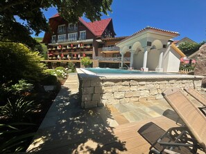 Outdoor pool, open 8:00 AM to 7:00 PM, pool umbrellas, pool loungers