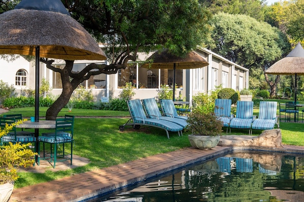Outdoor pool, pool umbrellas, pool loungers