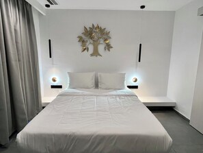Executive Quadruple Room, Courtyard View | Egyptian cotton sheets, premium bedding, down comforters