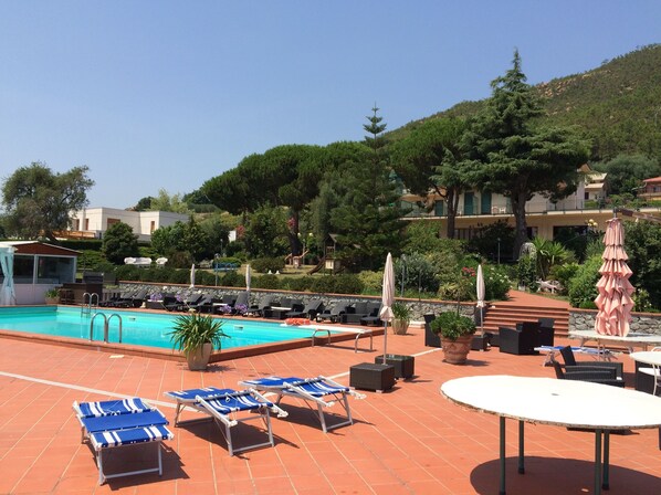 Outdoor pool, pool umbrellas, pool loungers