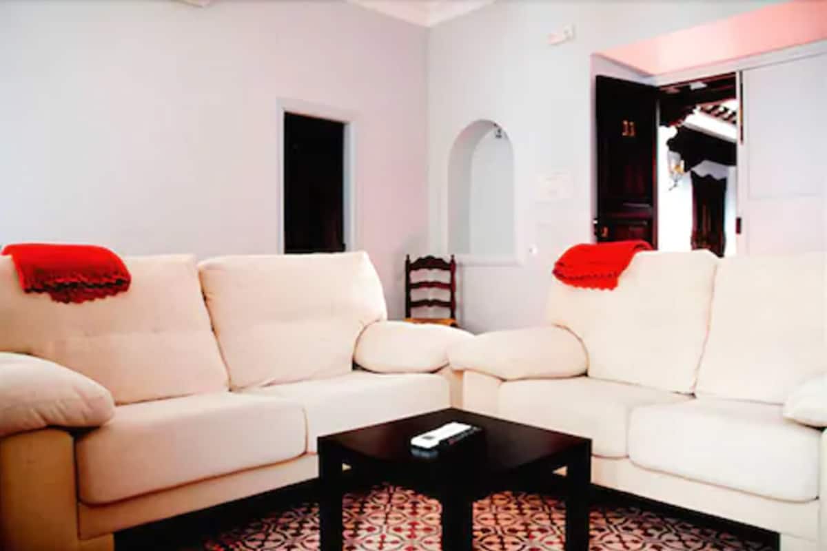 Triple Room, City View | Living area | Flat-screen TV