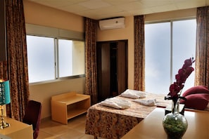 Standard Single Room, 1 King Bed, Sea View | Minibar, in-room safe, desk, free WiFi