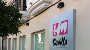 A hotel sign with the name "Sevilla Hotel" and a logo. - Hotel Sevilla (Ronda)