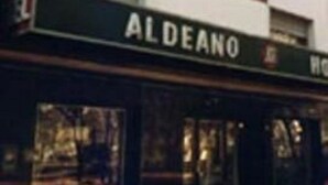 A hotel with a sign reading "ALDEANO HOTEL" and a street sign indicating "ALDEANO." - Aldeano II (Buenos Aires)