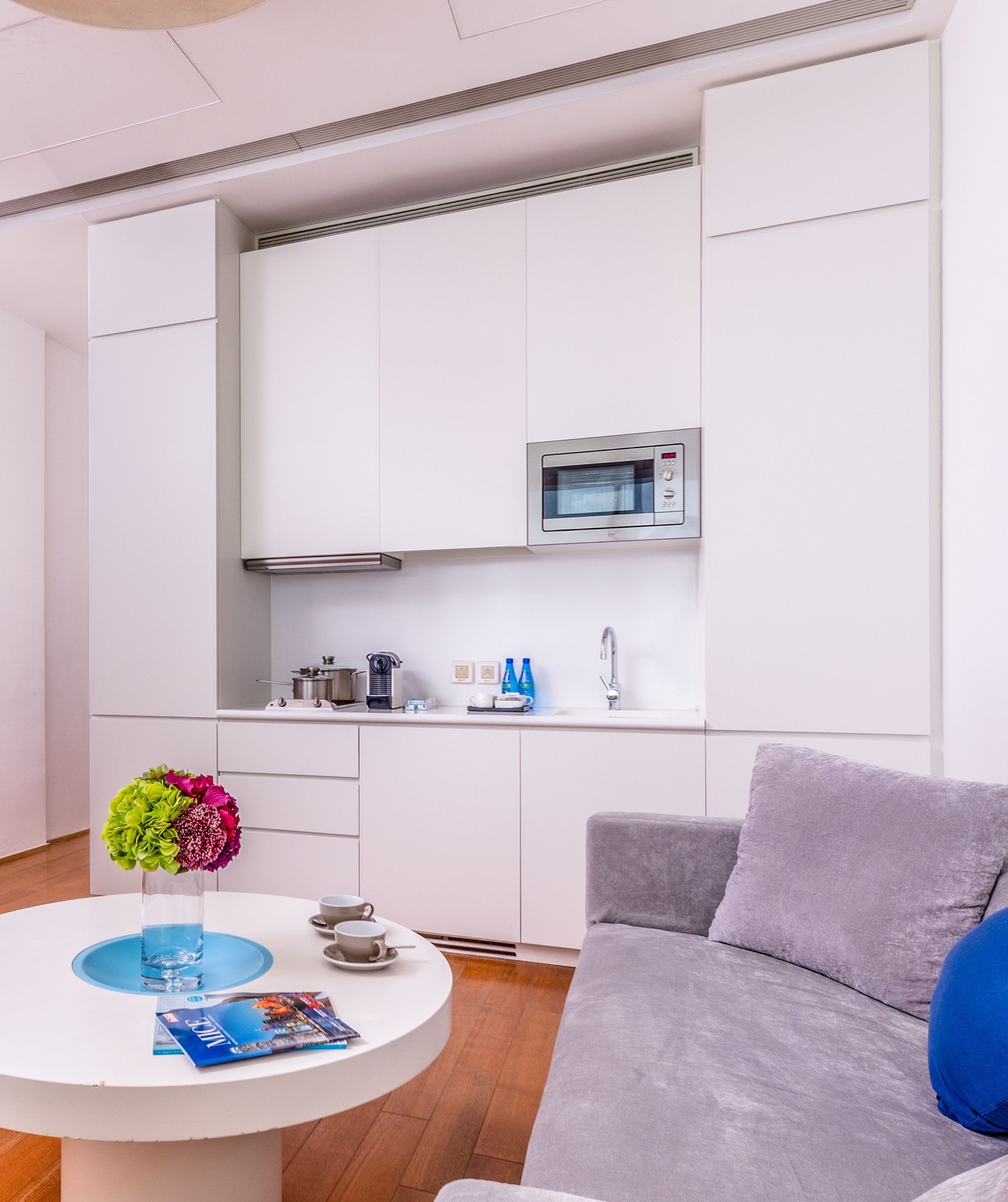 full-sized fridge, microwave, stovetop, coffee/tea maker