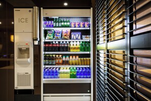 A vending machine with a variety of beverages and snacks. - Holiday Inn Express Amsterdam - South by IHG (Amsterdam)