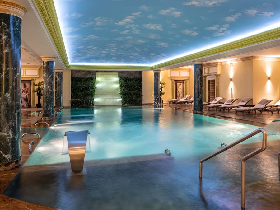 Indoor pool, open 7:00 AM to 11:00 PM, pool loungers