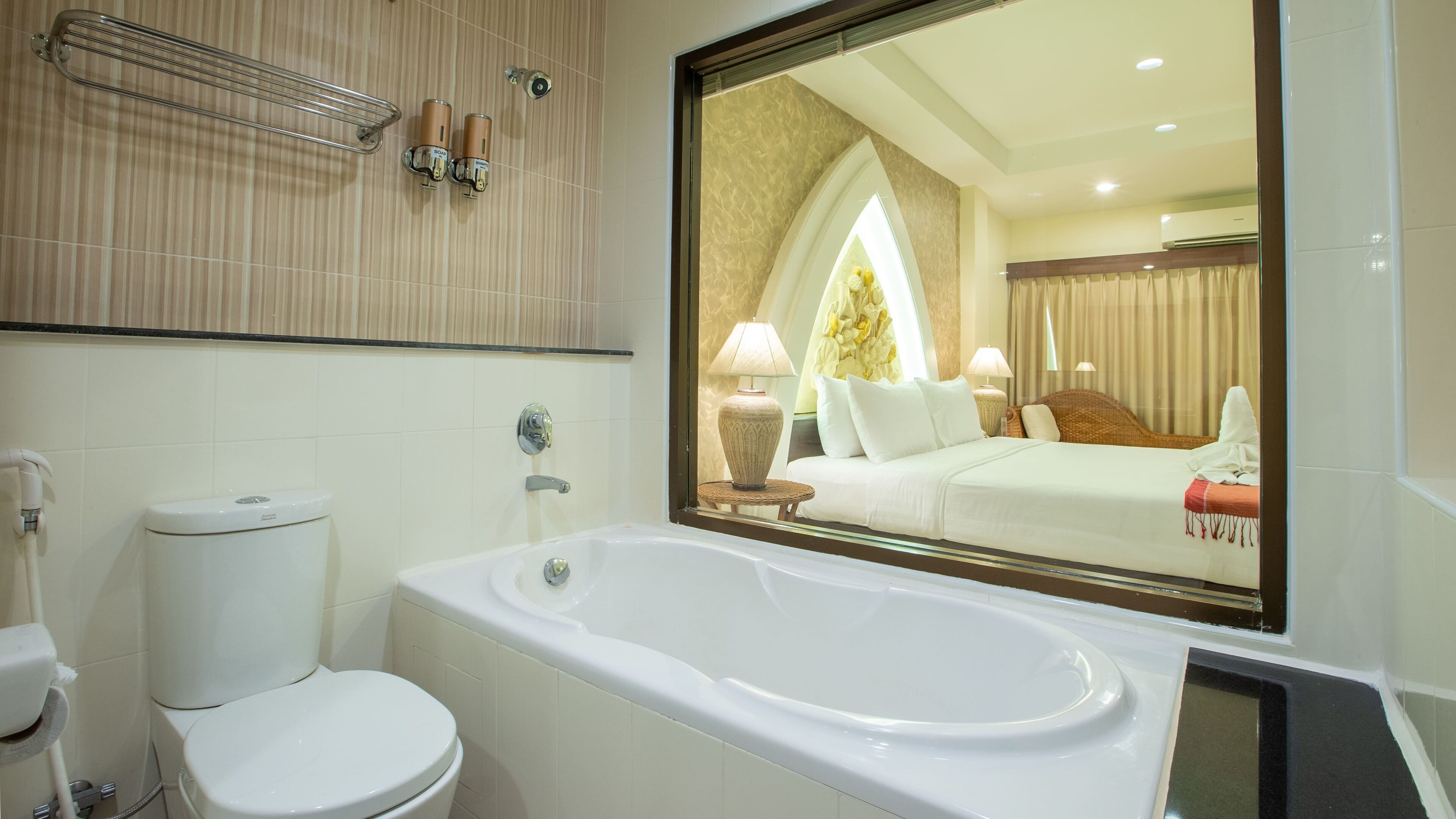 deluxe room | bathroom | hair dryer, slippers, towels