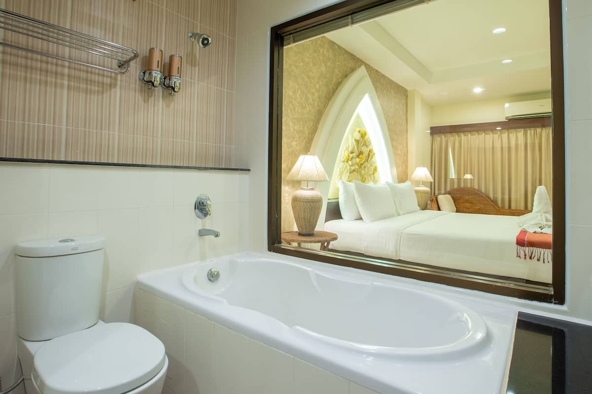 deluxe room | bathroom | hair dryer, slippers, towels