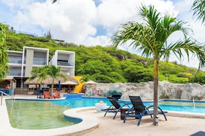 2 outdoor pools, open 7:00 AM to 10:00 PM, pool umbrellas, pool loungers - The Ritz Village Hotel  (Willemstad)