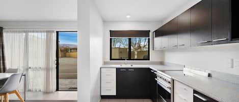 Two Bedroom | 1 bedroom, desk, blackout drapes, iron/ironing board