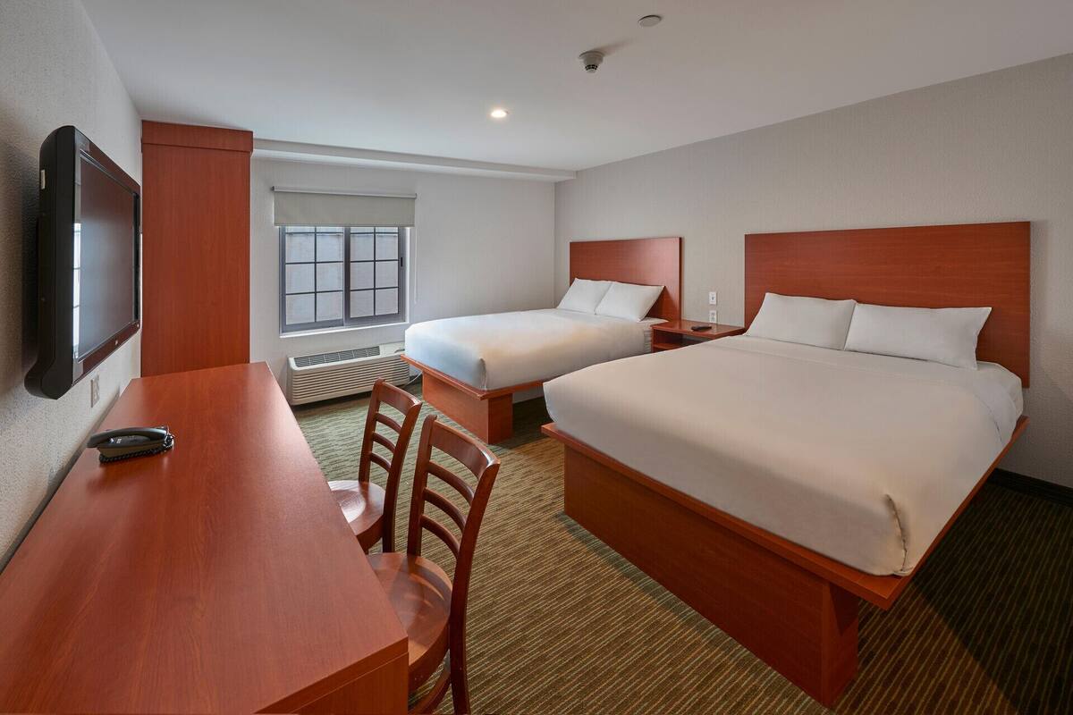 Desk, blackout drapes, alarm clocks, bed sheets