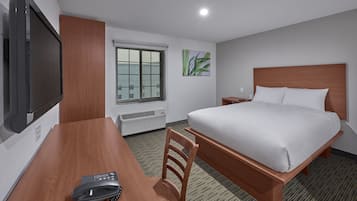 Desk, blackout curtains, bed sheets, alarm clocks