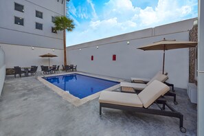 Outdoor pool, open 9:00 AM to 8:00 PM, pool umbrellas, pool loungers