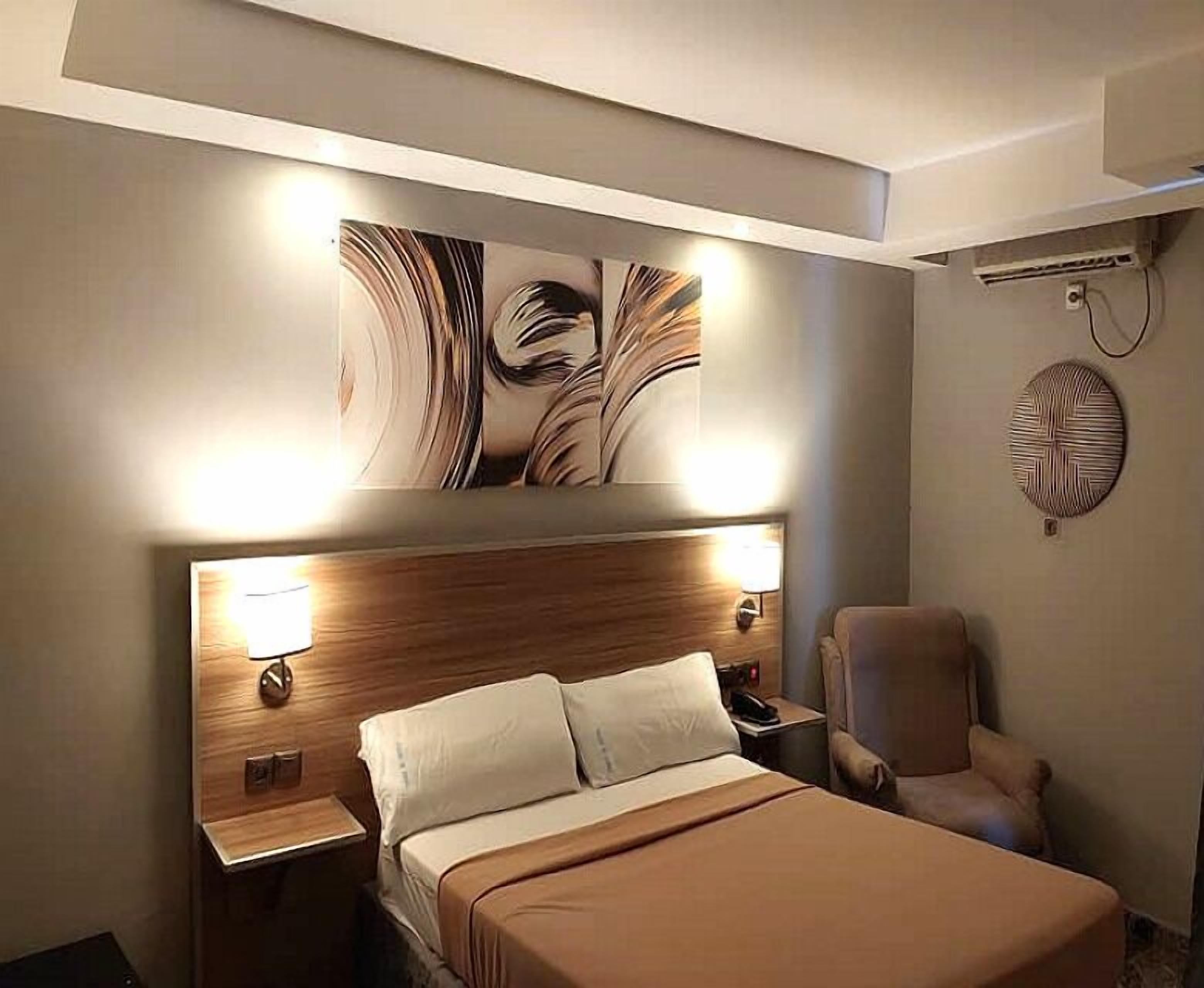 Standard Double Room | Minibar, individually furnished, desk, blackout drapes
