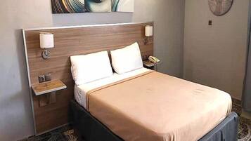 Standard Double Room | Minibar, individually furnished, desk, blackout drapes