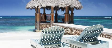 Private beach, sun loungers, beach towels, beach massages