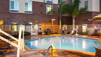 Outdoor pool, open 6:00 AM to 10:00 PM, pool umbrellas, pool loungers