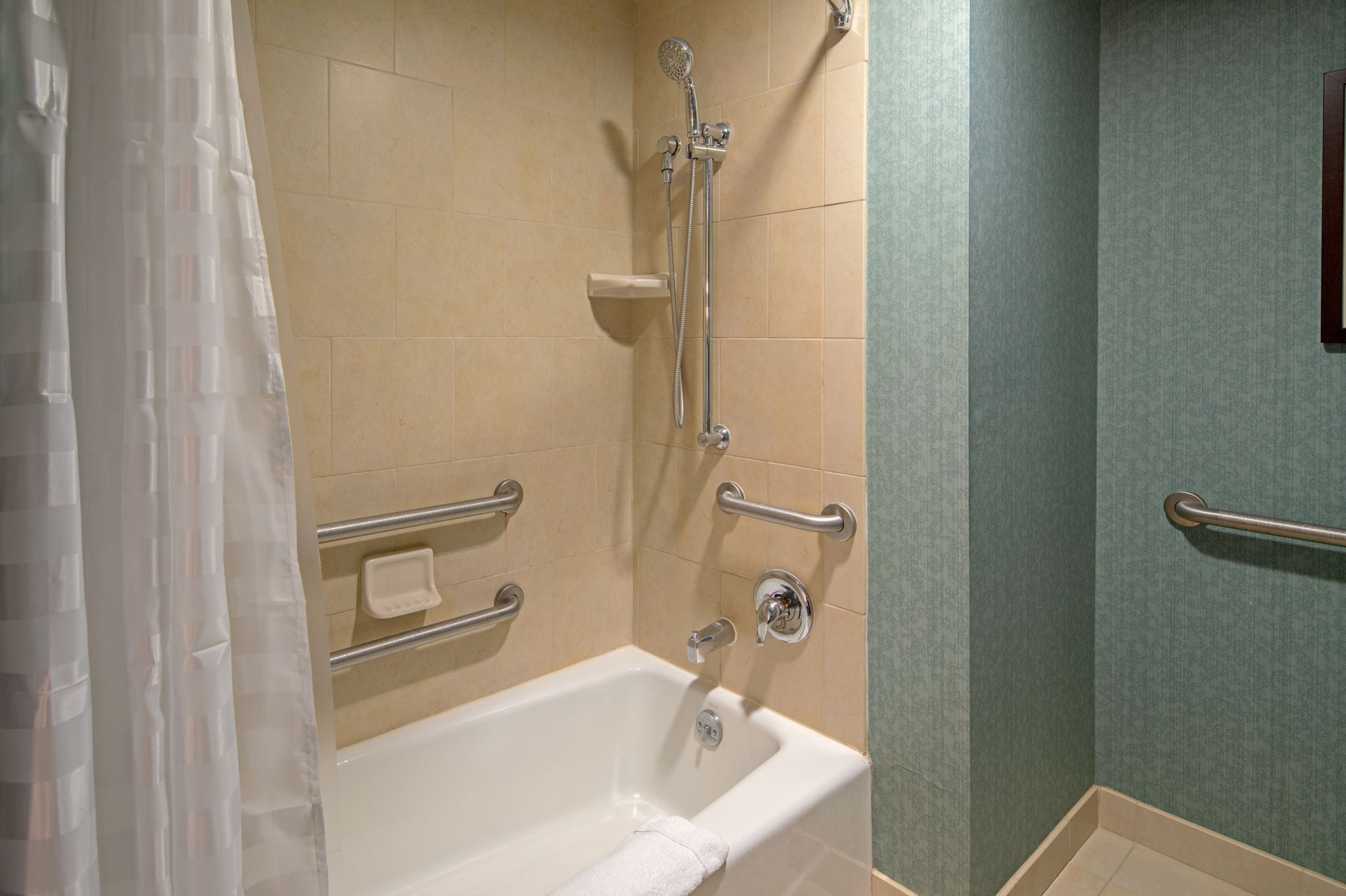 designer toiletries, hair dryer, towels