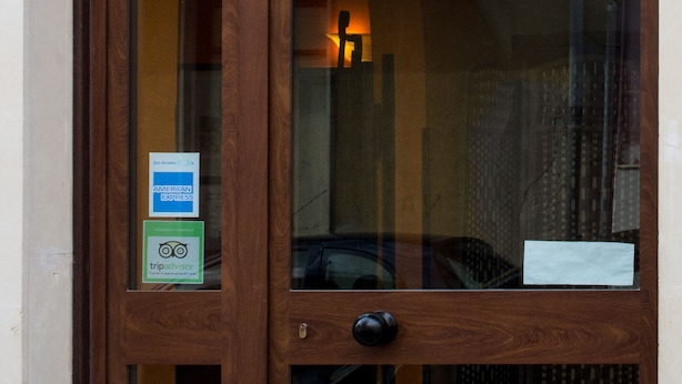 A wooden hotel entrance with a sign reading "HOTEL POPULUS." - Populus (Syracuse)