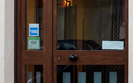 A wooden hotel entrance with a sign reading "HOTEL POPULUS."