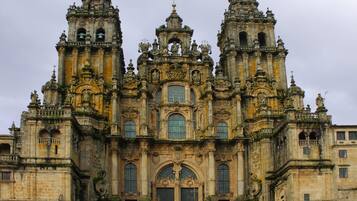 A historic cathedral with intricate architecture, multiple towers, and large arched windows.
