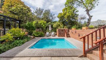 Outdoor pool, pool umbrellas, sun loungers