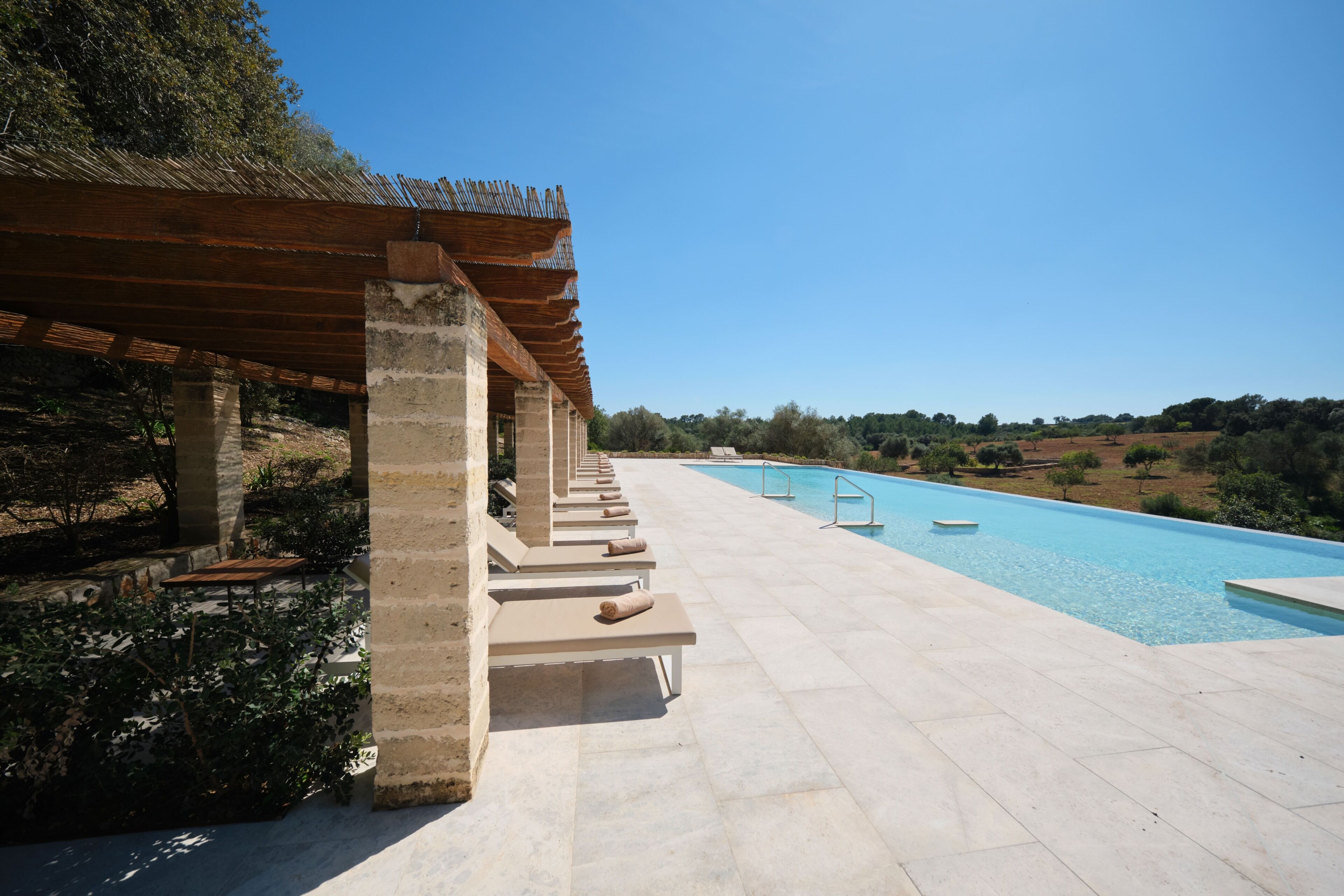 Indoor pool, outdoor pool, pool umbrellas, pool loungers