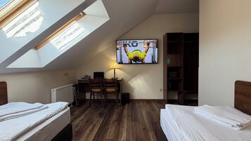 Attic Twin Room | Hypo-allergenic bedding available, in-room safe, desk, blackout drapes
